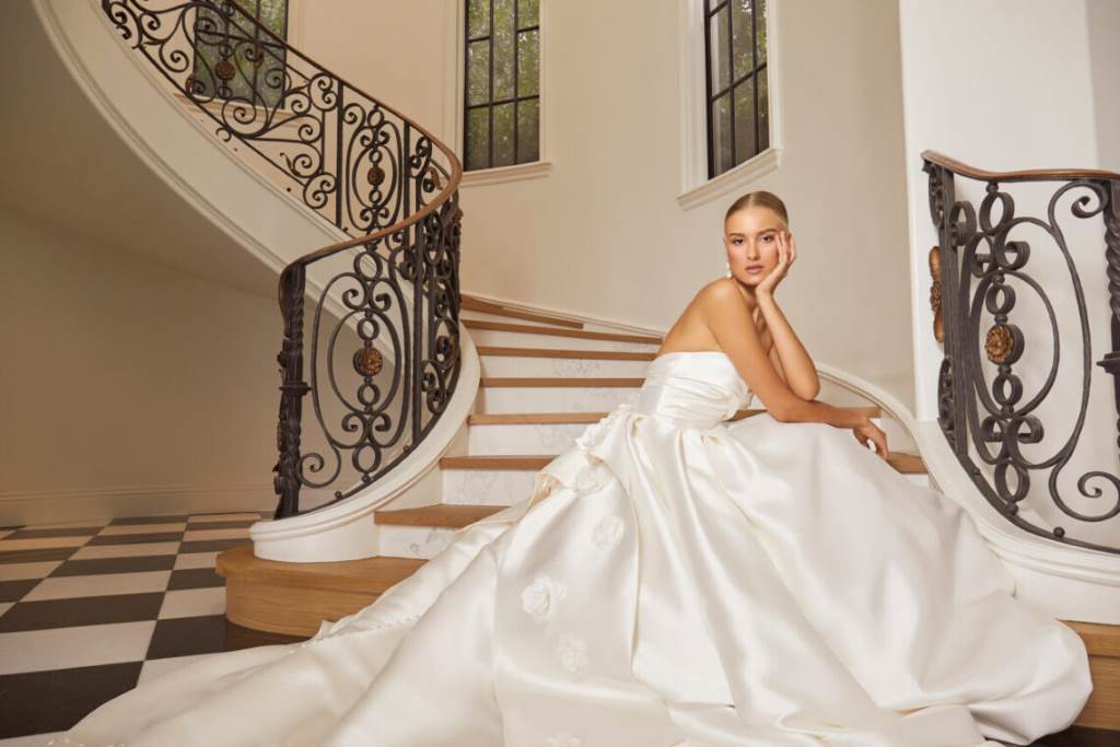 Bride in a Casablanca Bridal gown with intricate lace details